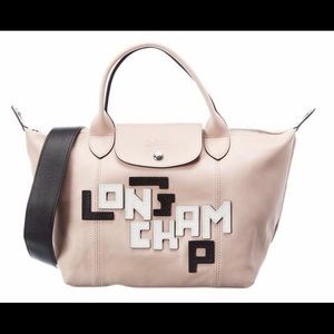 Authentic Longchamp Le Pliage short handle tote in pink leather/silver hardware